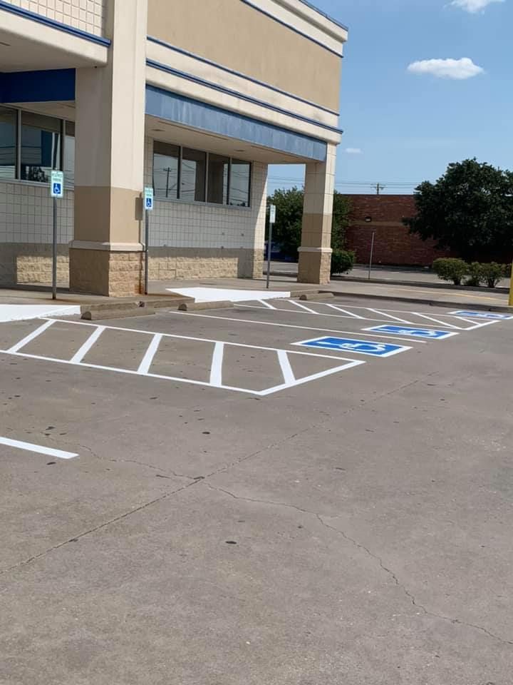 A handicapped parking spot in front of a building