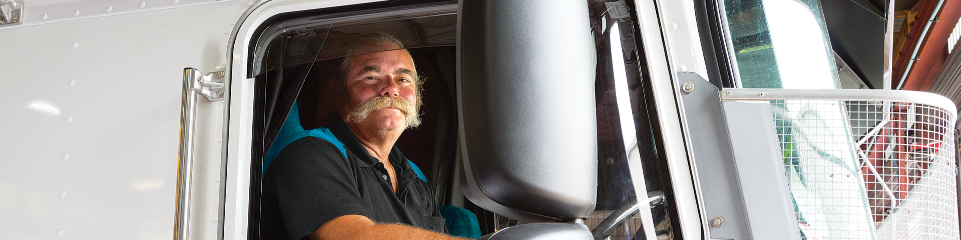 Truck driver in Icepack shirt as part of branding work by Willmore Design for Icepack's brochure and website.