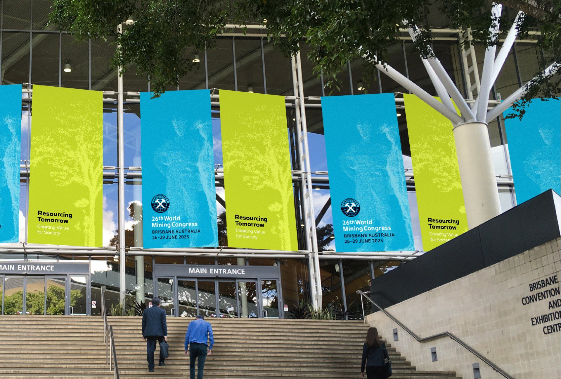 World Mining Congress banners are hanging over the entrance windows of the Brisbane Convention Centre with WMC branding