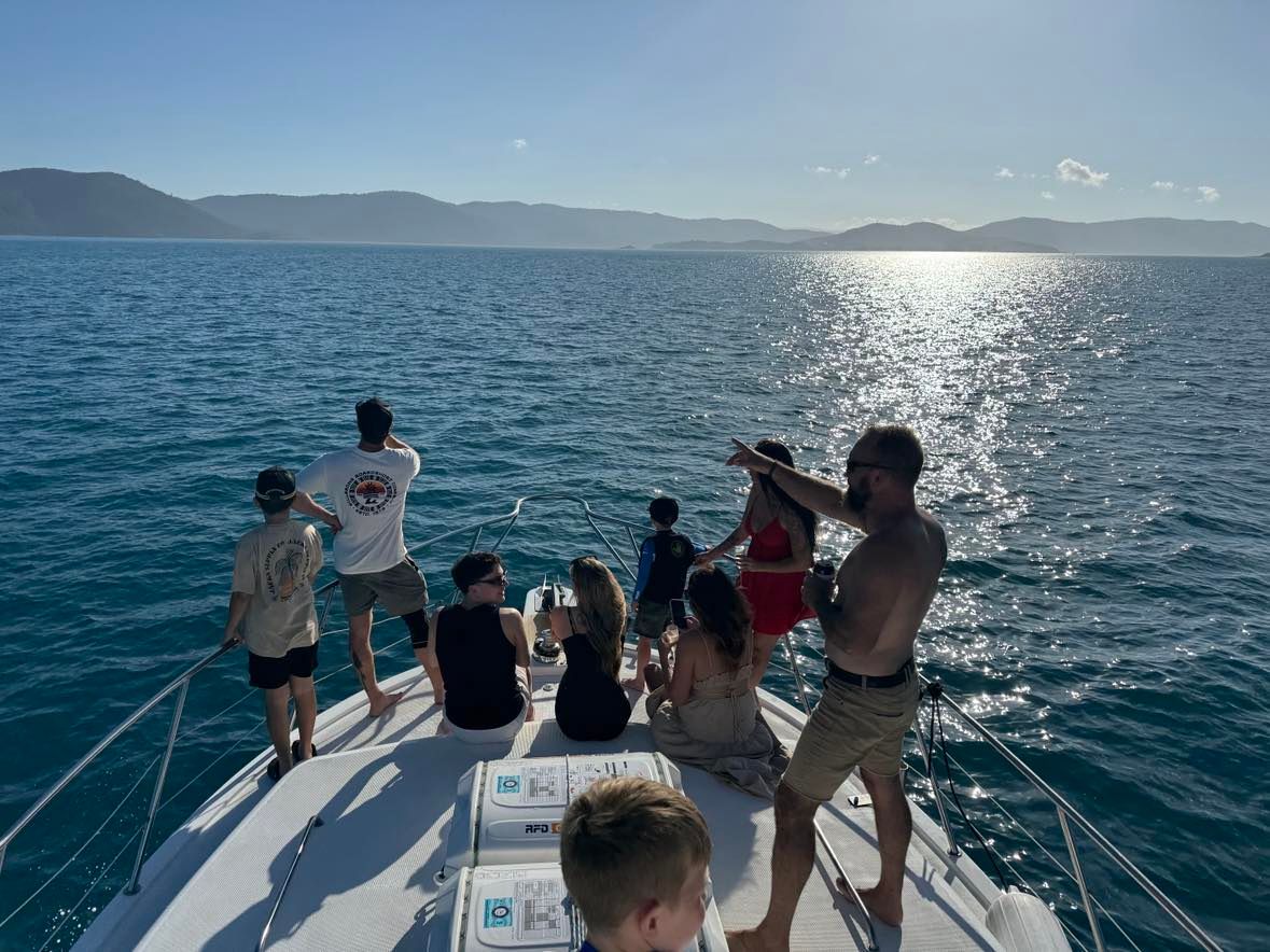 A Group of People Are Posing for a Picture With Fish on a Boat — Whitsunday Fishing Charters In Airlie Beach, QLD
