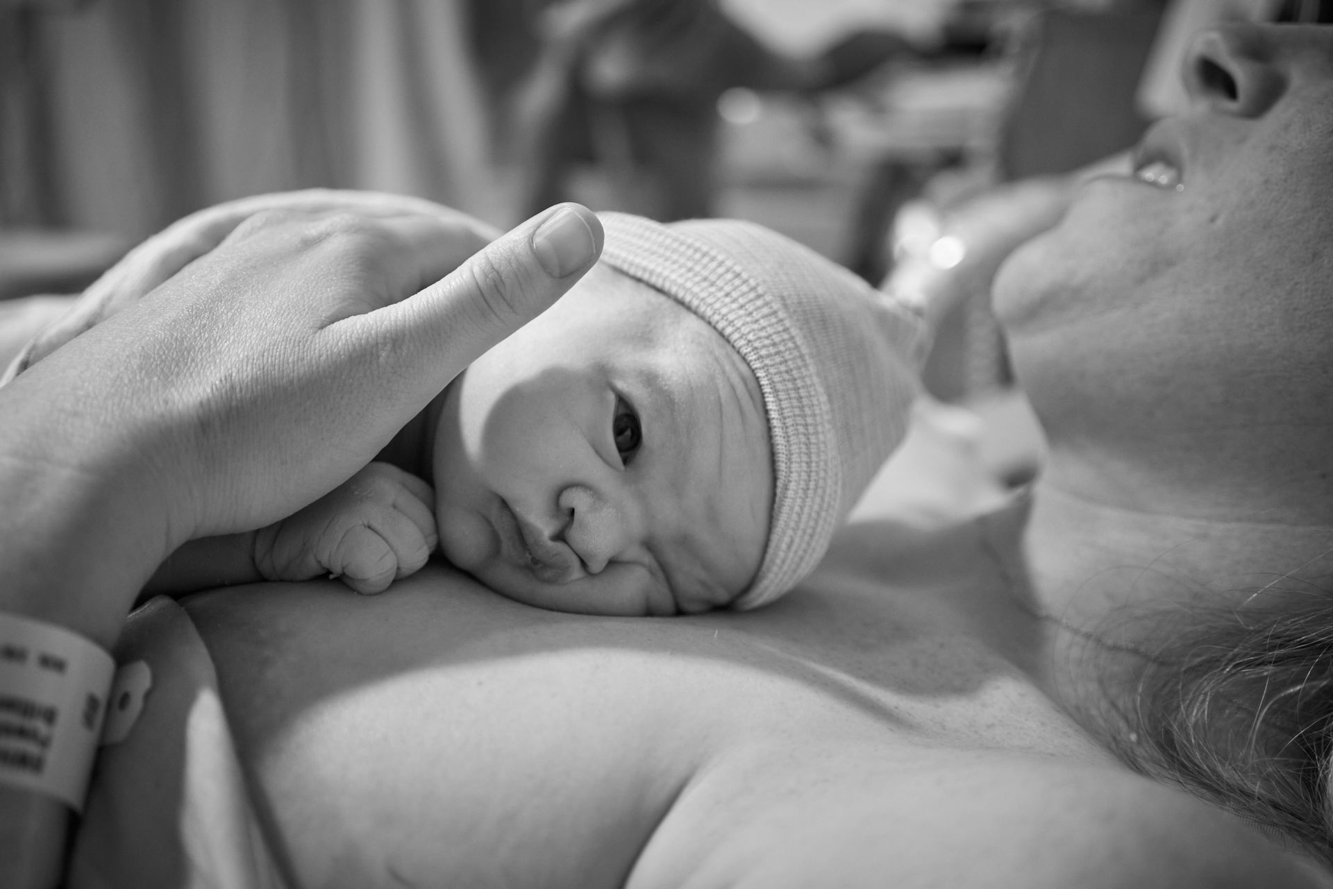 Newborn baby resting on mother's chest