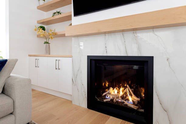 A living room with a fireplace and a flat screen tv.