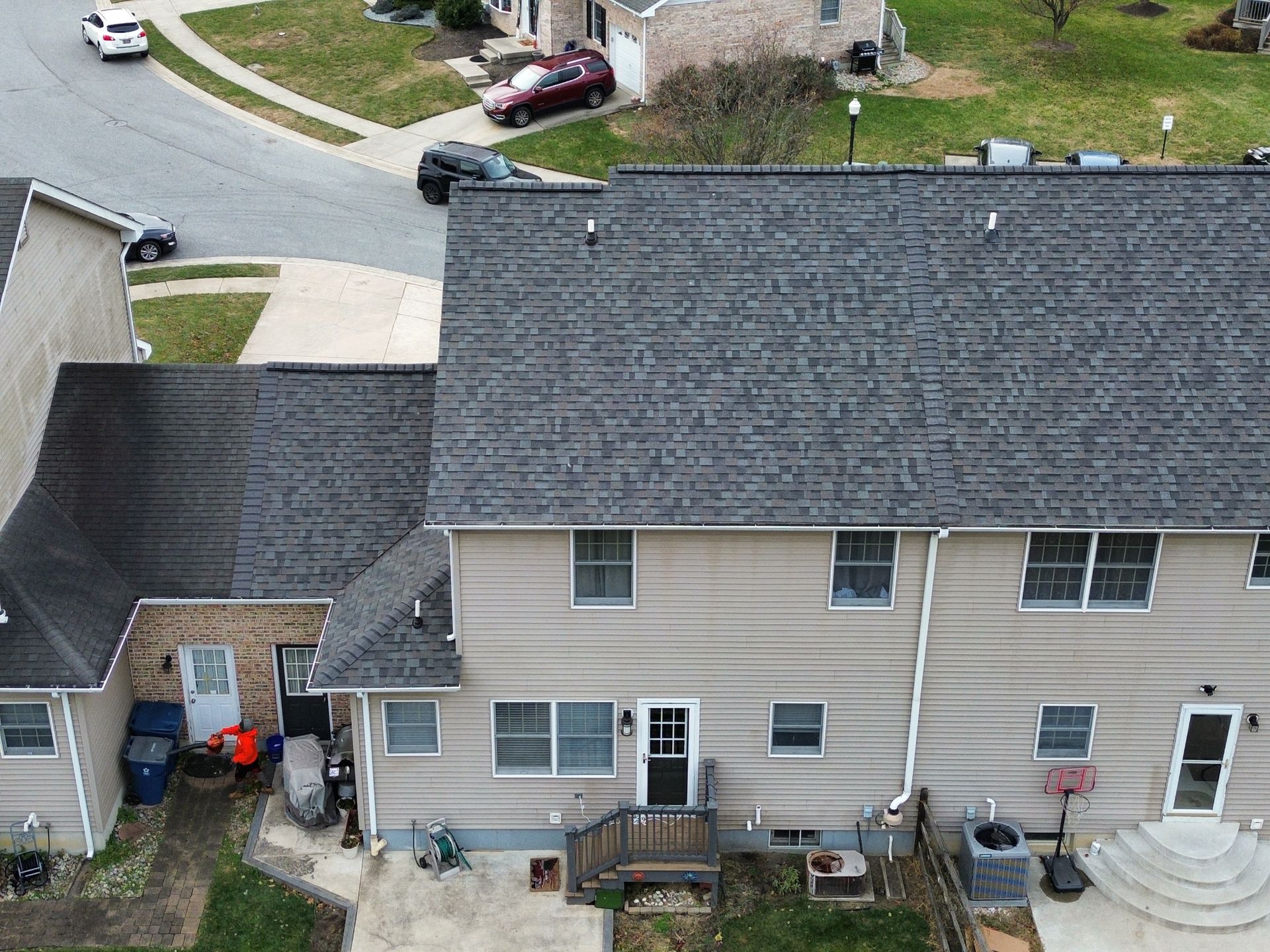 An aerial view of a house with a gray roof.