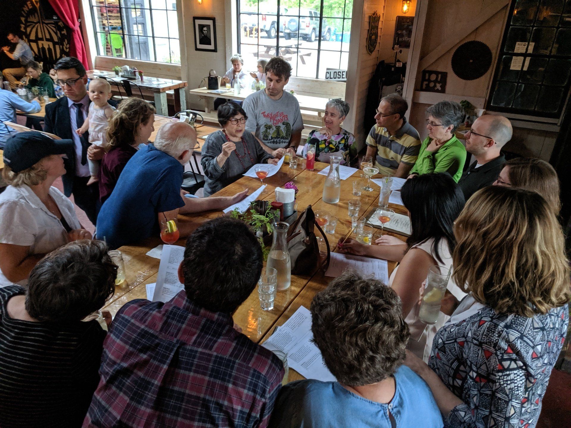 Photo of a group of people gathered around a table