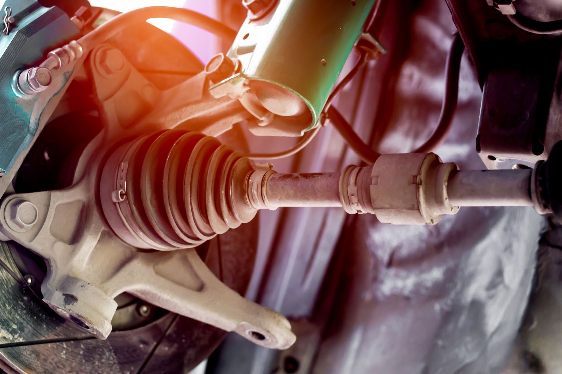 A close up of a suspension system on a car. A close up of a suspension system on a car.
