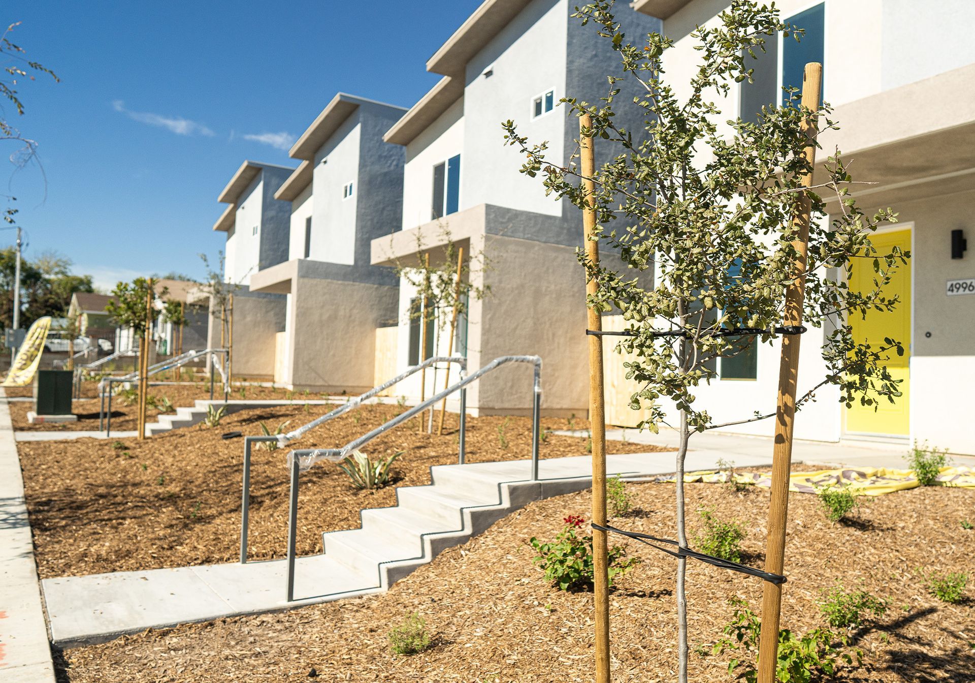 A row of houses with stairs leading up to them