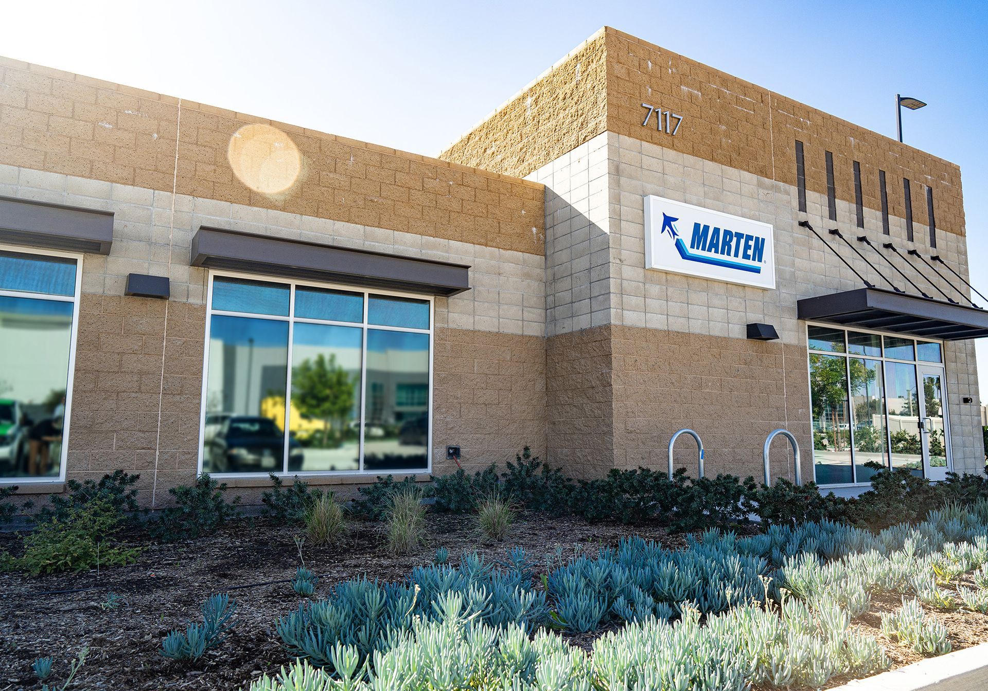 A large brick building with a sign that says master on it.