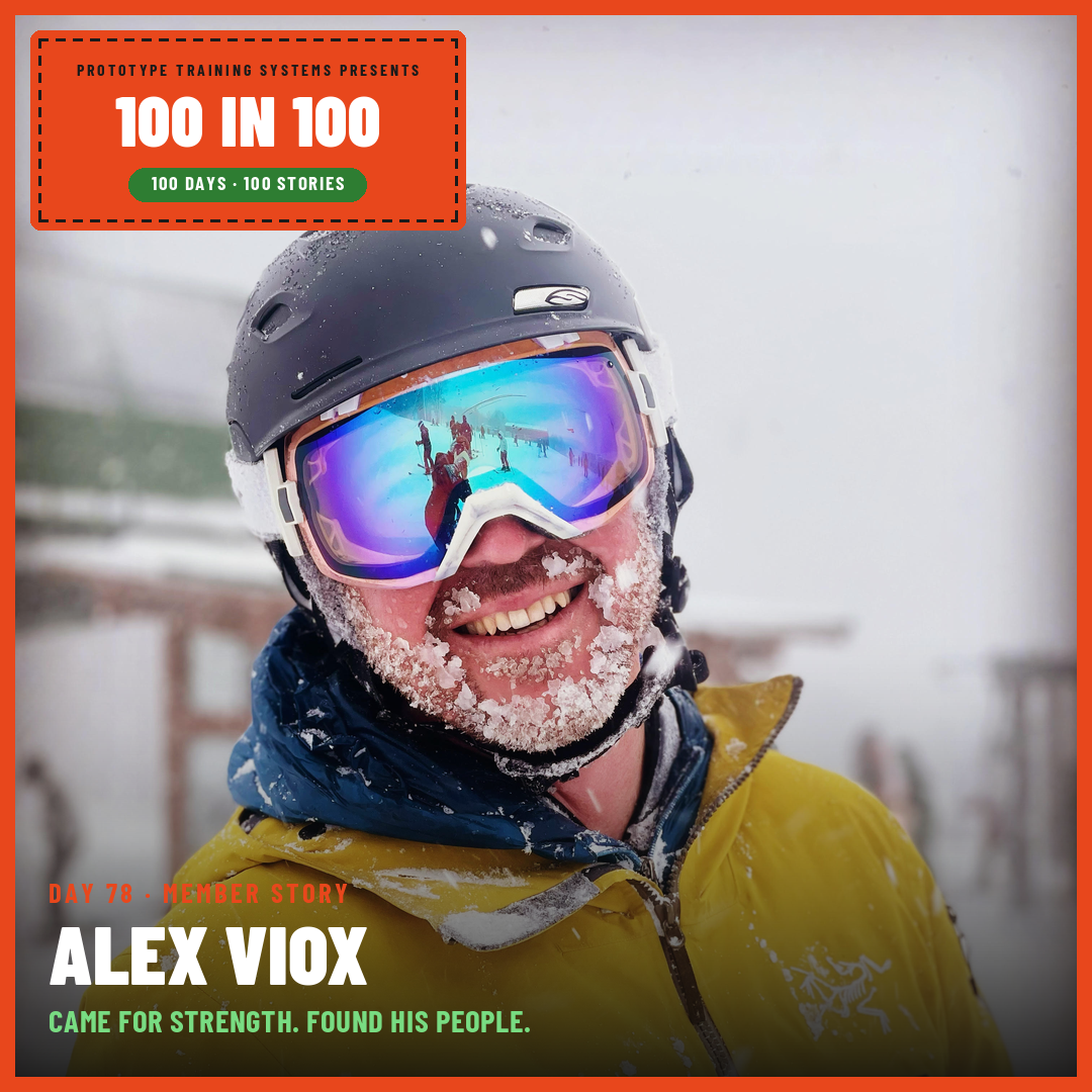 Alex Viox smiling in ski gear, covered in snow