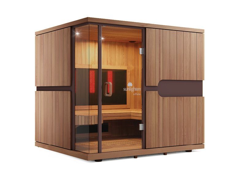 Wooden outdoor sauna with glass front doors and a glowing warm interior