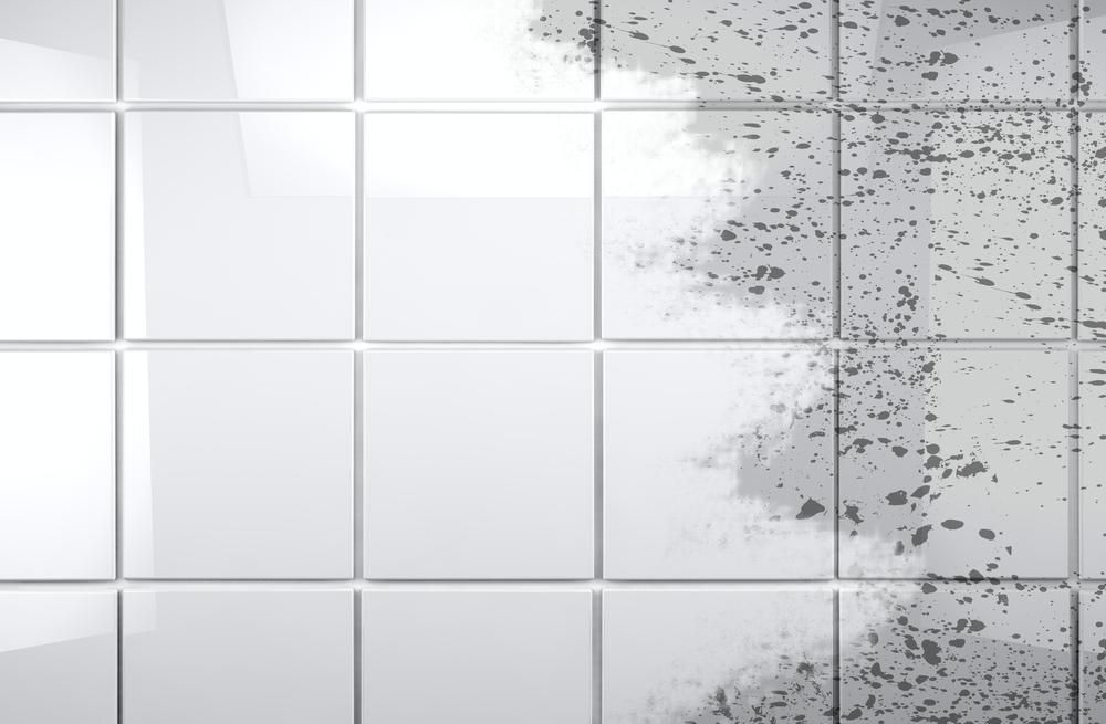 A Close Up of a White Tile Wall With Mold Growing on It Pin Icon — Rugrats Carpet Cleaning Service In Charlotte Bay, NSW