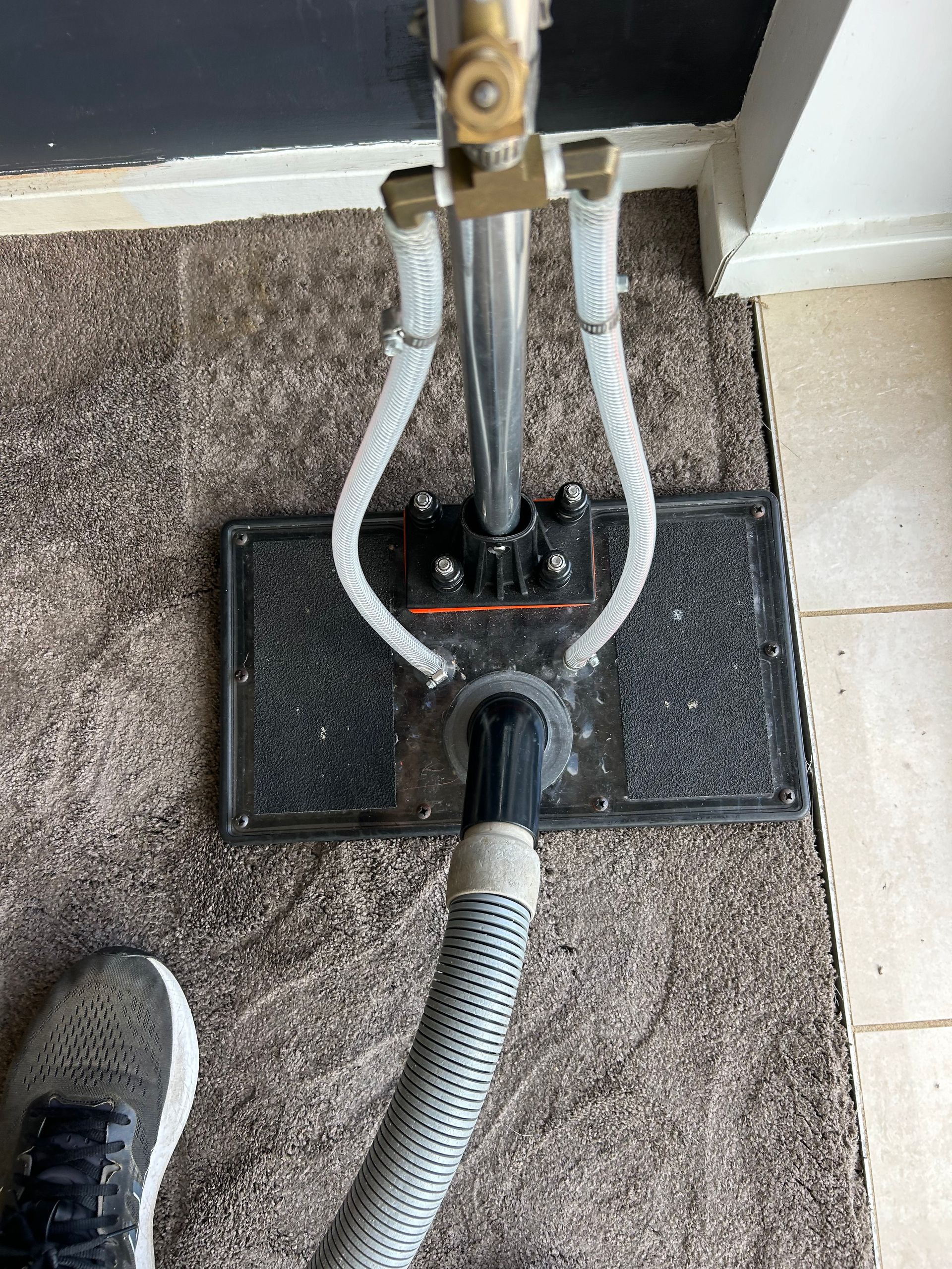A Person is Cleaning a Mattress With a Vacuum Cleaner — Rugrats Carpet Cleaning Service In Old Bar, NSW