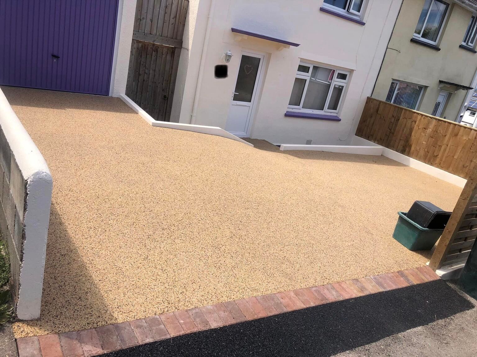 Yellow resin driveway installation.