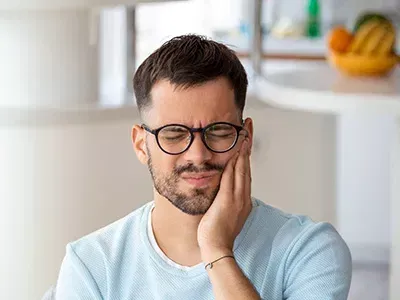 A panoramic dental x-ray with the four wisdom teeth highlighted.