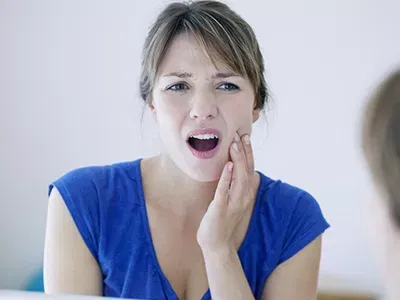 An x-ray being reviewed, showing an unerupted tooth.