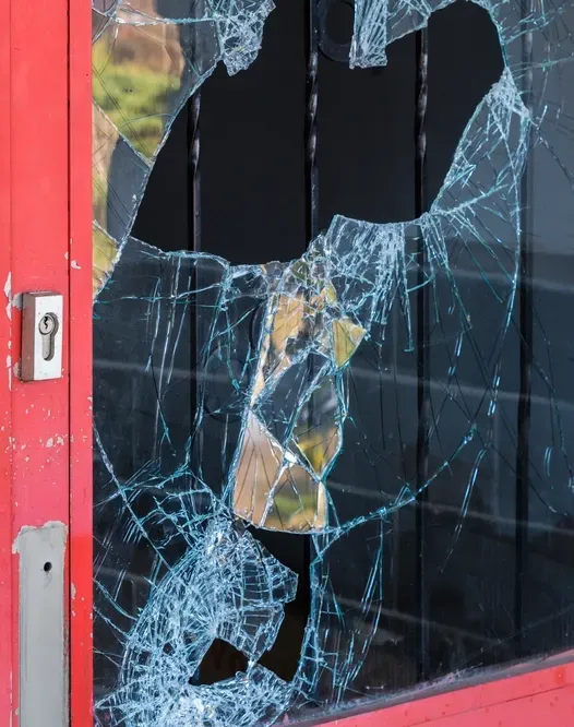 A Broken Glass Shopfront Door — Precision Doors in Berrimah, NT