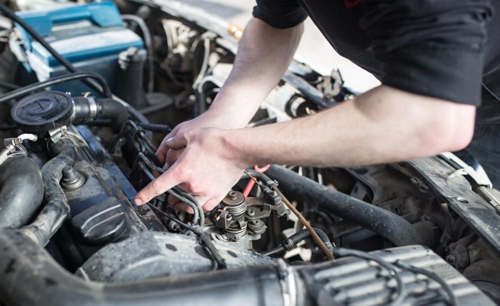 A Man Is Working on The Airconditioning of The Car — Ag Auto Spark in Narromine, NSW