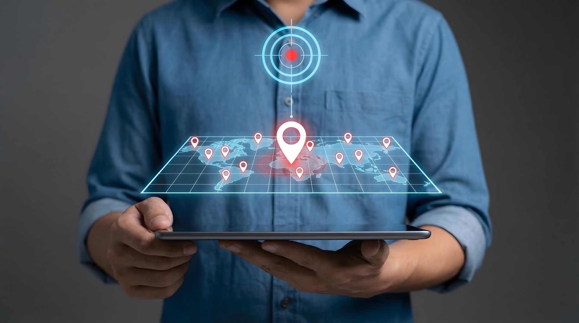 Person holding a tablet with a glowing digital map and location pins overlay.