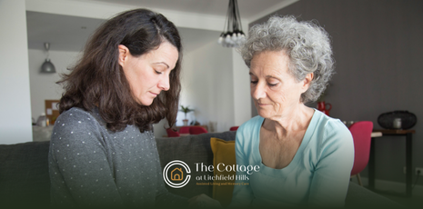 A family caregiver talking to her senior mother