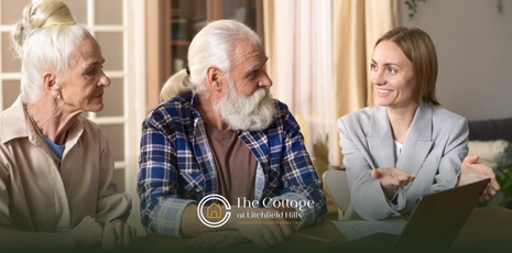 A woman talking to her elderly parents about health needs