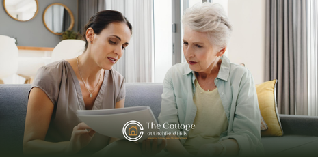 A woman is preparing her senior mother for her first senior living tour by showing her a magazine