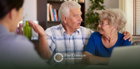 A senior couple talking to a caregiver about advance care planning