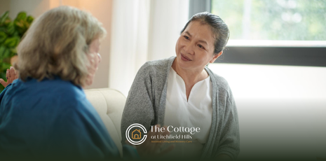 A woman talking to a senior about moving into assisted living