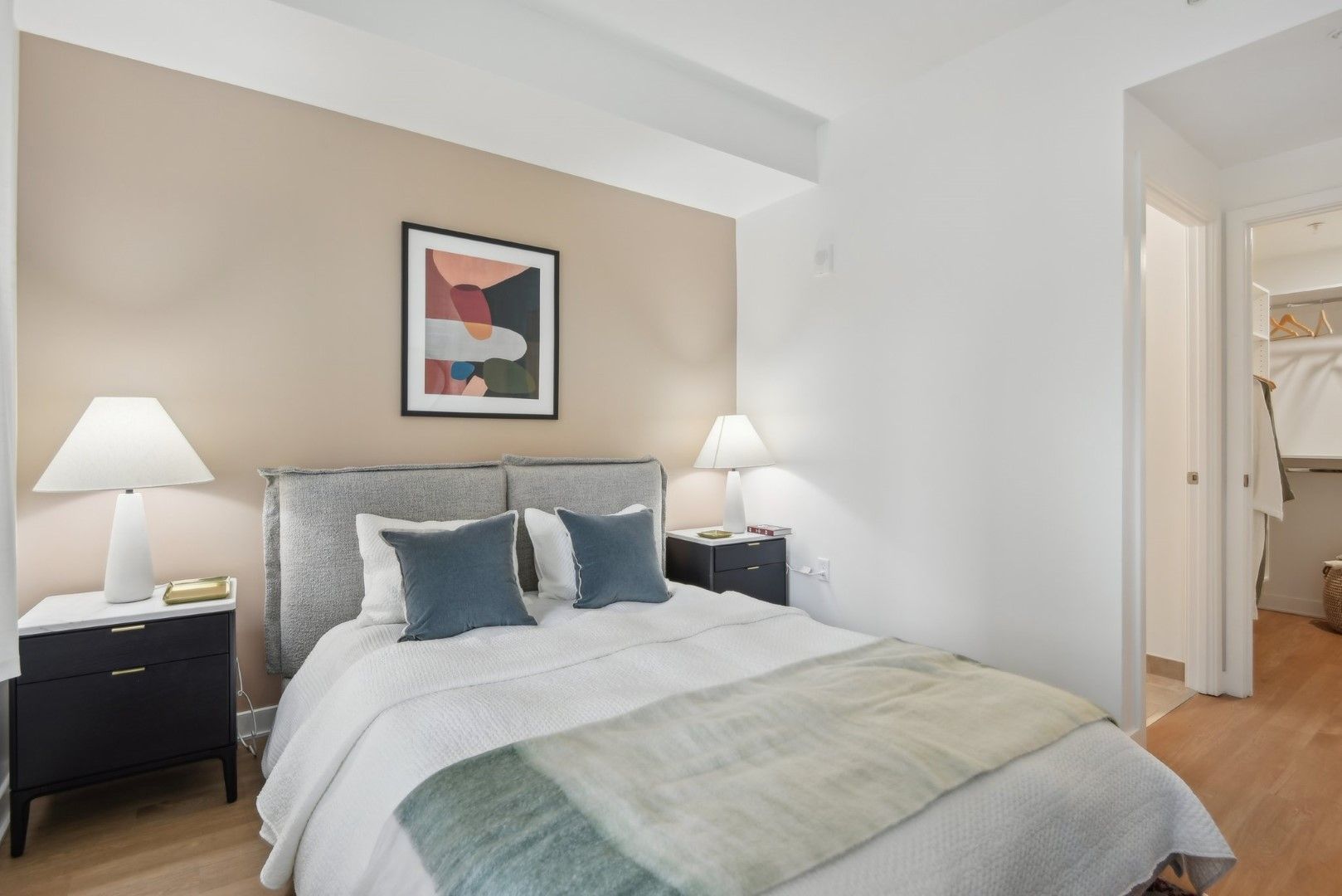A bedroom with a large bed and two nightstands  at  Solaire 7607 Old Georgetown in Bethesda, MD