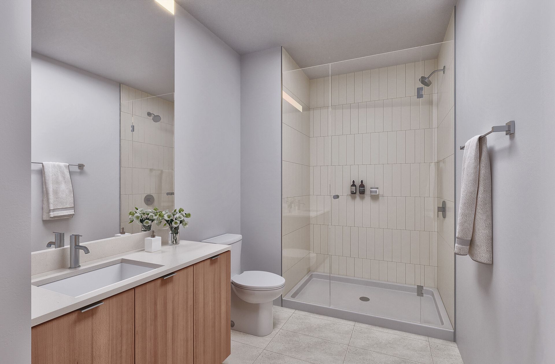 A bathroom with a toilet , sink , mirror and walk in shower  at  Solaire 7607 Old Georgetown in Bethesda, MD