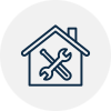 Blue house outline with crossed wrench and screwdriver, representing home repair or maintenance.