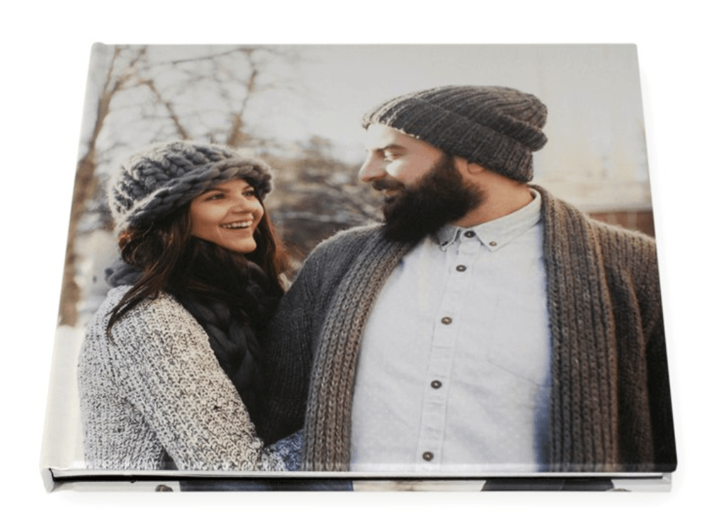A man and a woman are standing next to each other and looking at each other.