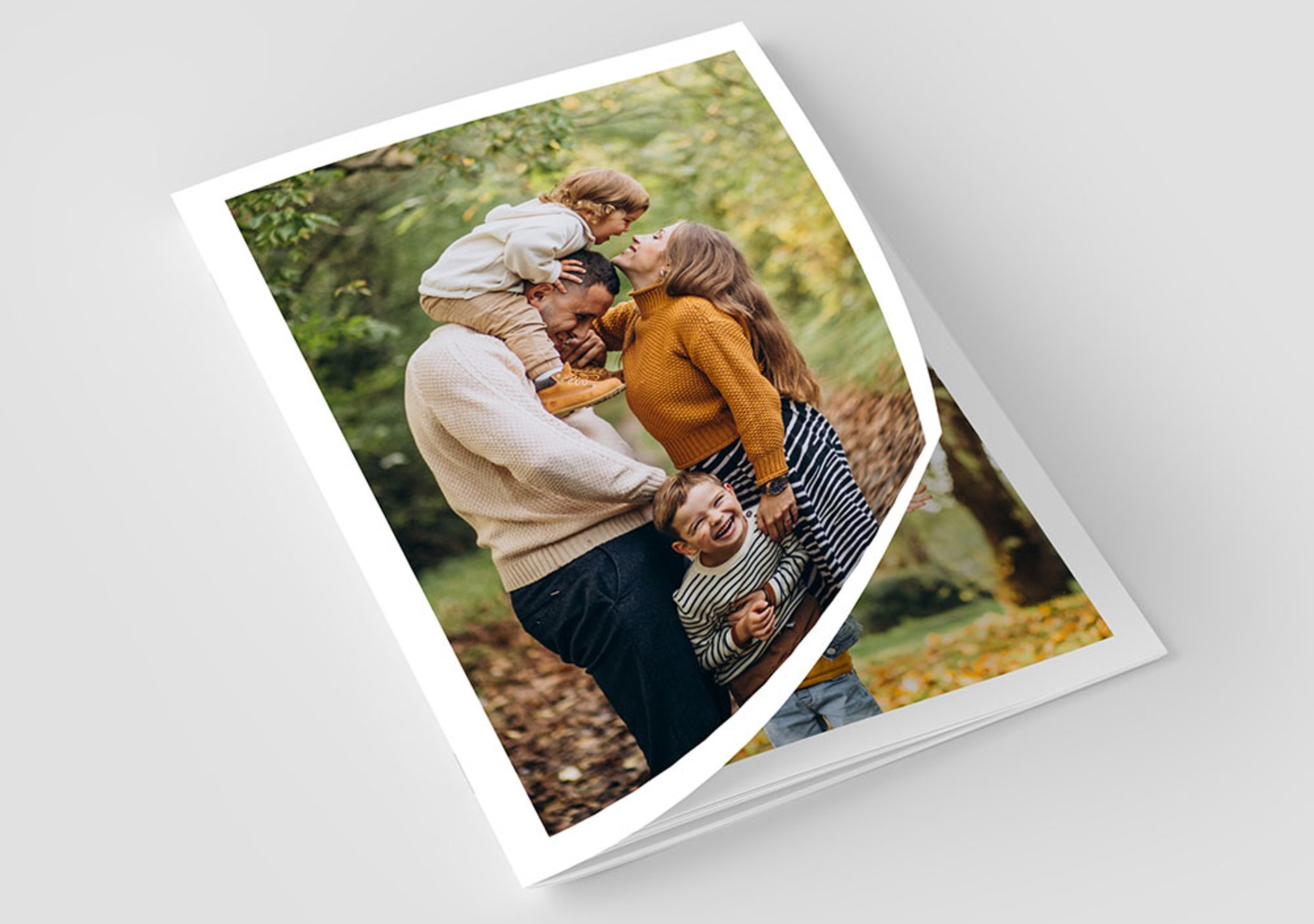 A picture of a family standing next to each other in a park.