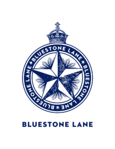 Bluestone Lane logo with navy compass emblem and text on white background