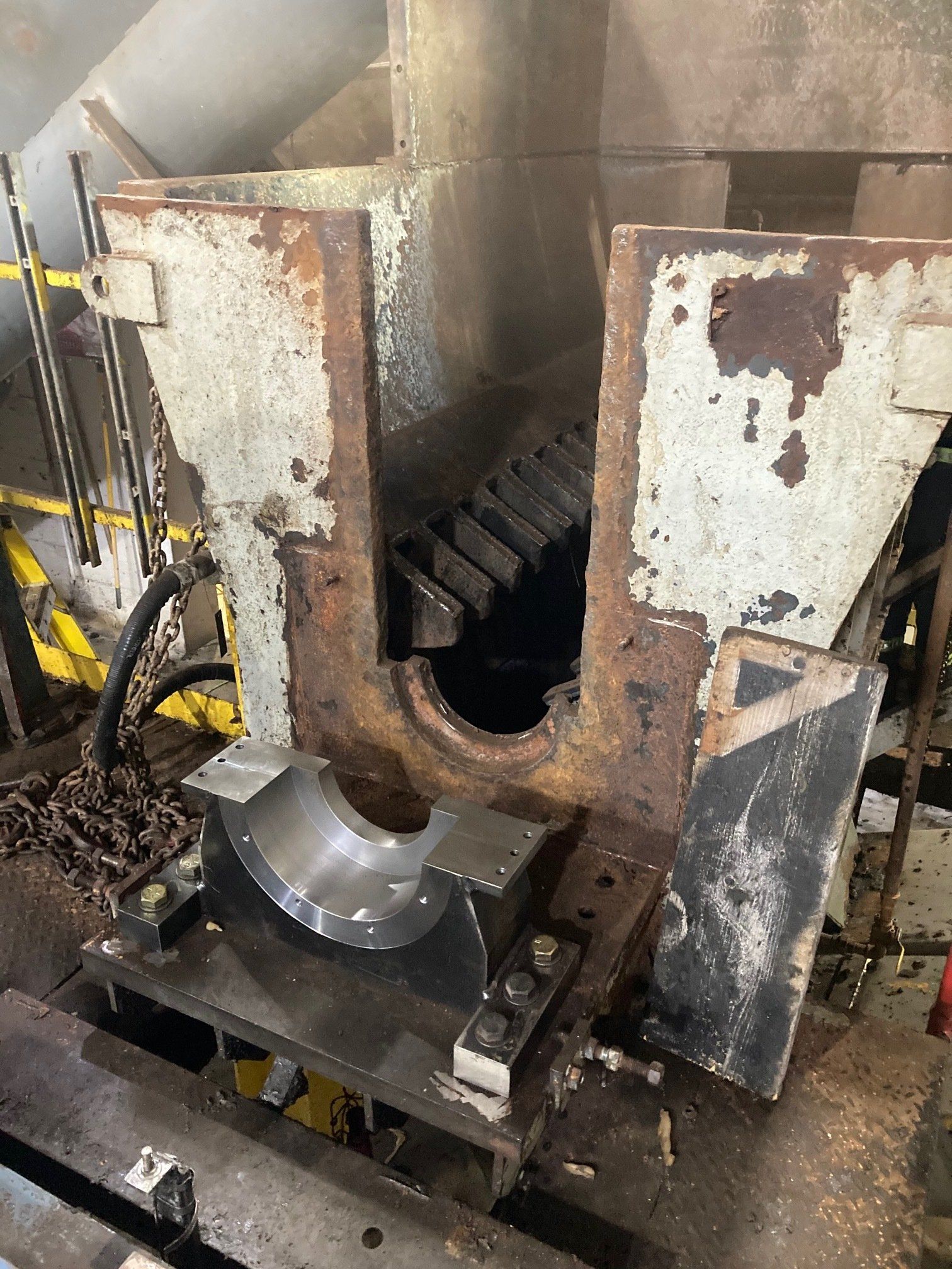 A machine is sitting on top of a table in a factory.