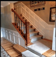 A Picture Of A Stairs With Wooden Handrail — Millersville, MD — Chesapeake Construction, Inc.