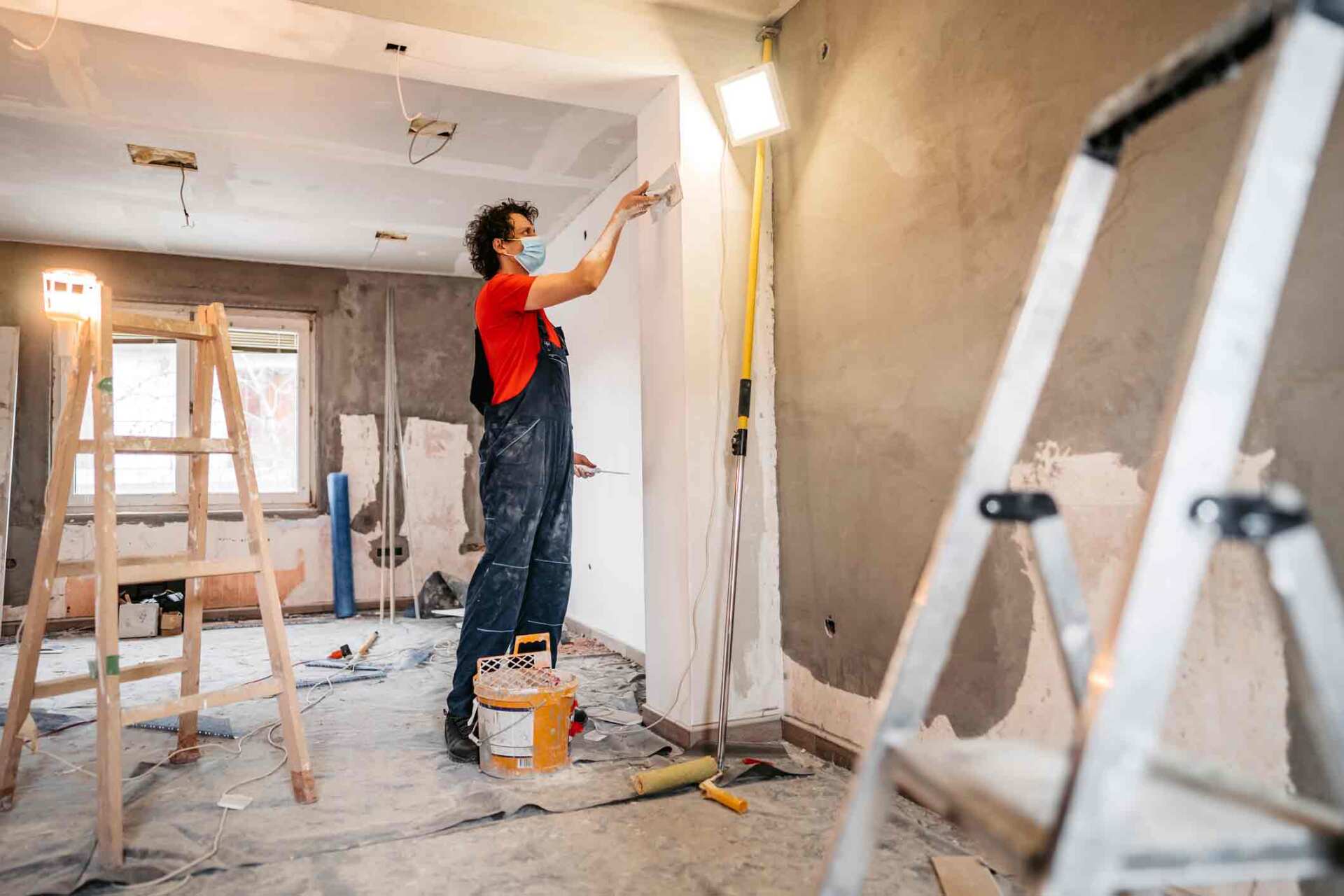 Carpenter Painting The Wall — Millersville, MD — Chesapeake Construction, Inc. Carpenter Painting The Wall — Millersville, MD — Chesapeake Construction, Inc.