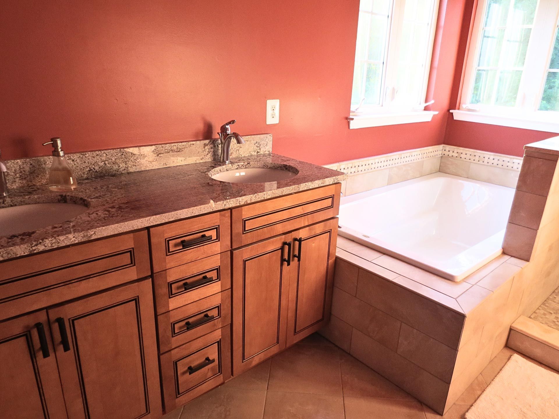 A bathroom with a sink and a tub in it