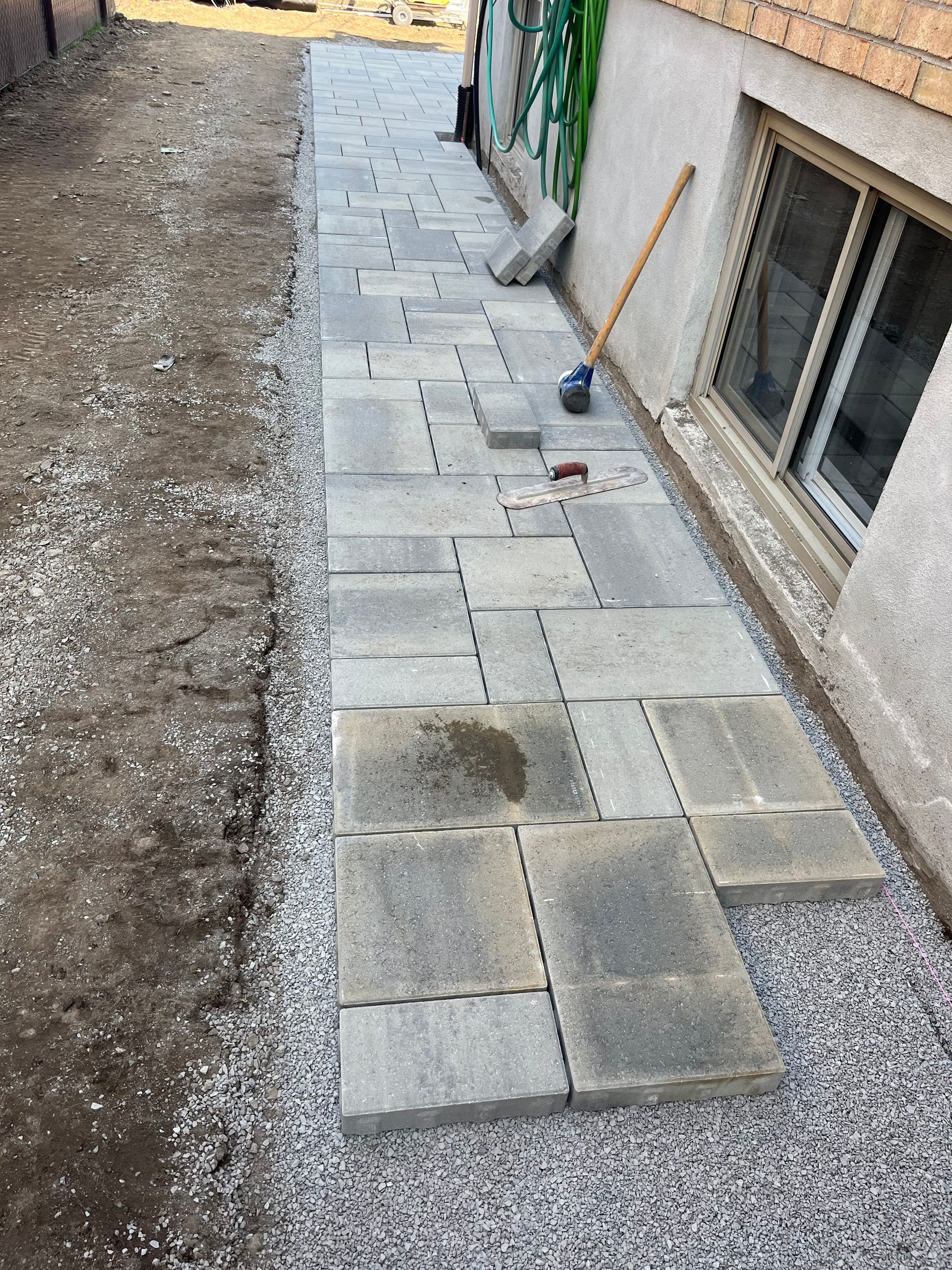 A sidewalk is being built in front of a building