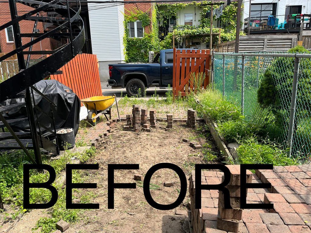 A before picture of a garden with a truck in the background.