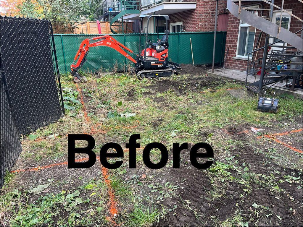 A before picture of a backyard with a small excavator.