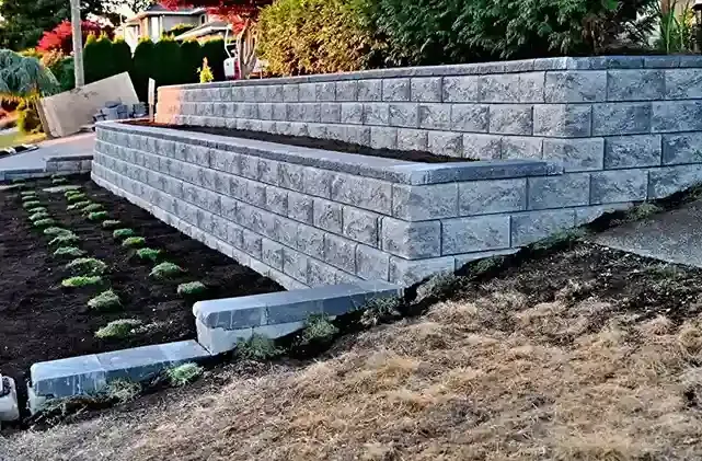 A brick wall with a planter in the middle of it