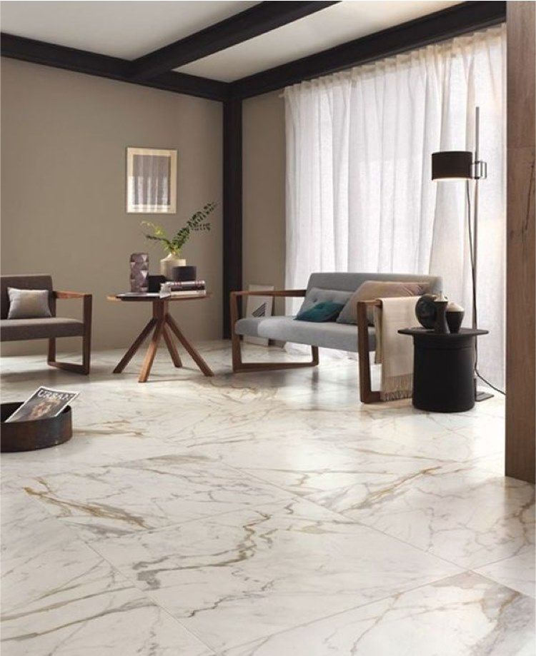 Living room with marble flooring, wooden beams, neutral walls, and modern furniture.