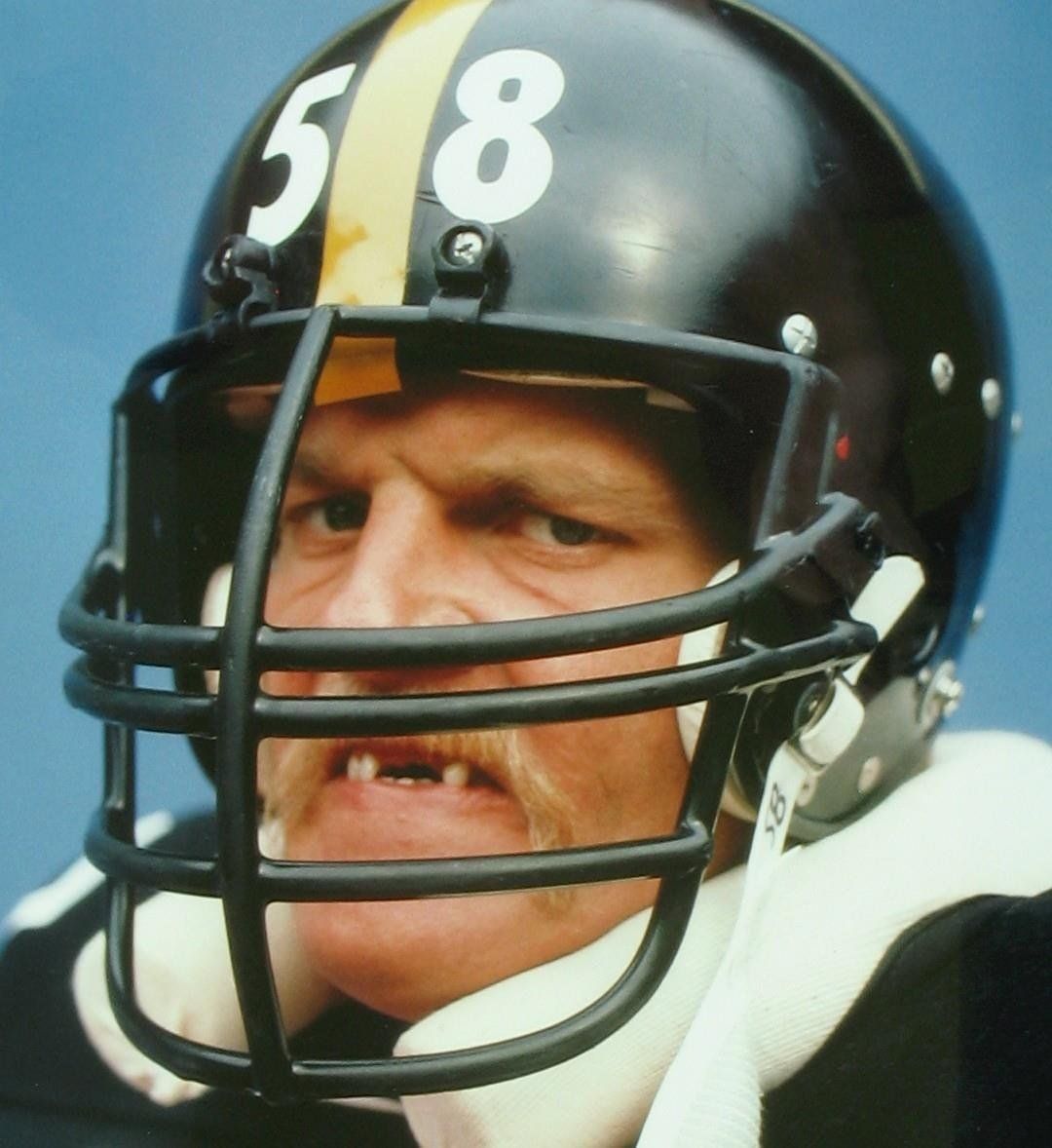 A man wearing a helmet with the number 58 on it