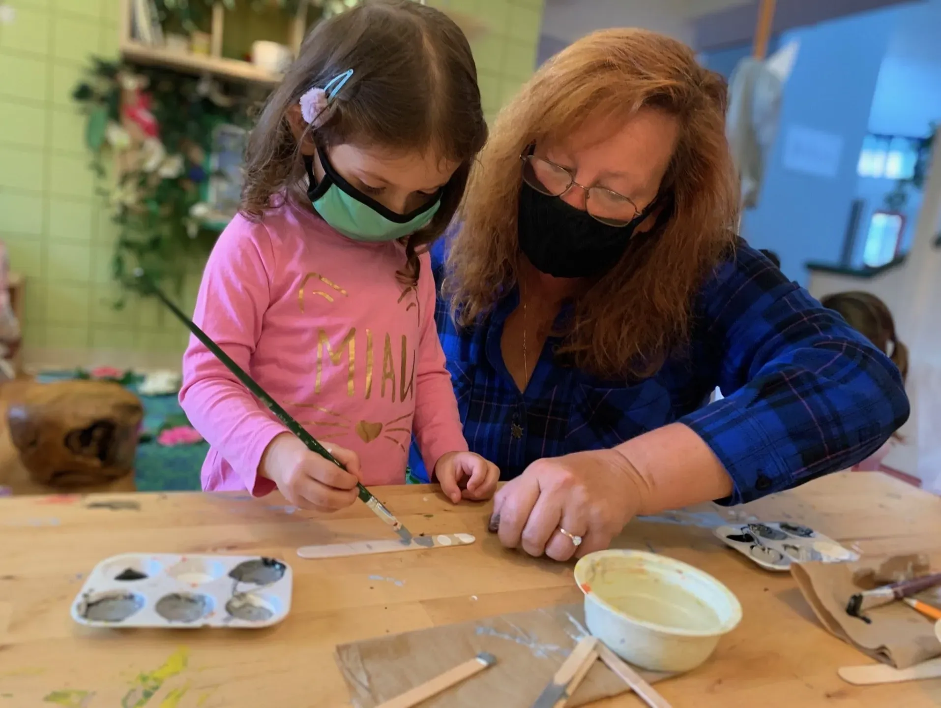 training the kid to paint