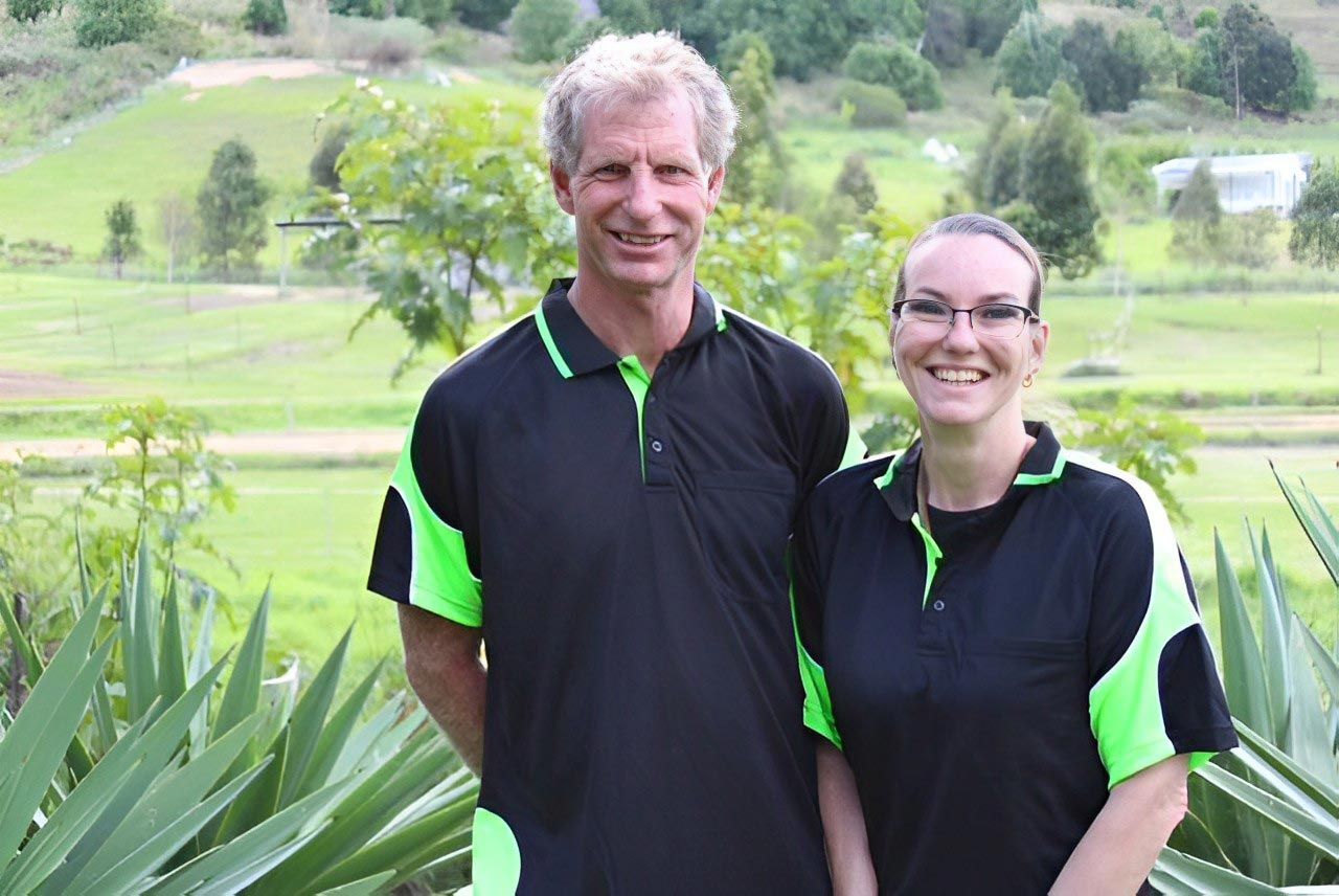 A Man and Woman Smiling — All Tree and Stump Works in Gold Coast QLD