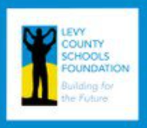 Levy County Schools Foundation logo: Silhouette of person holding up child in front of blue/yellow background, white frame, text.