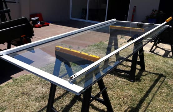 A piece of glass is sitting on top of a table.