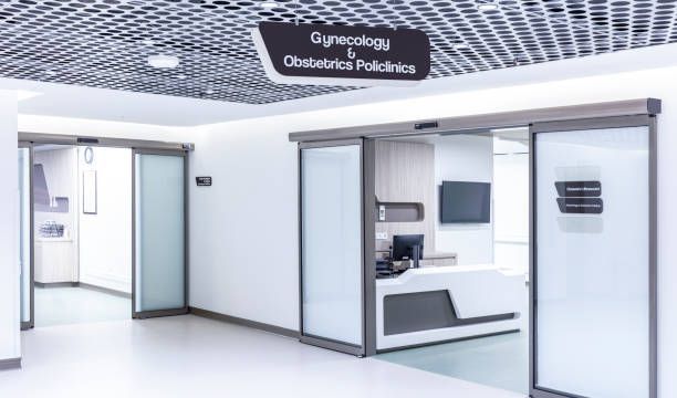 There is a sign above the door that says gynecology and obstetrics policlinics.