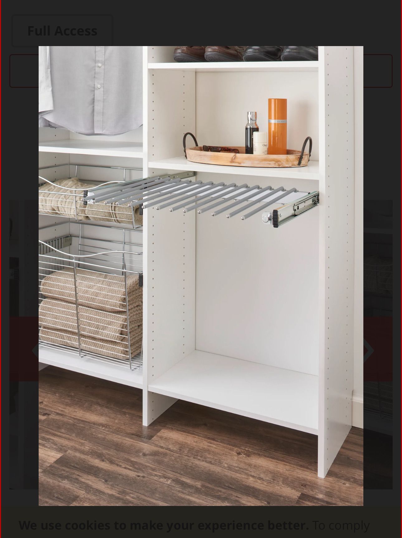 White closet with pull-out pants rack, shelves, and storage baskets on a wooden floor.