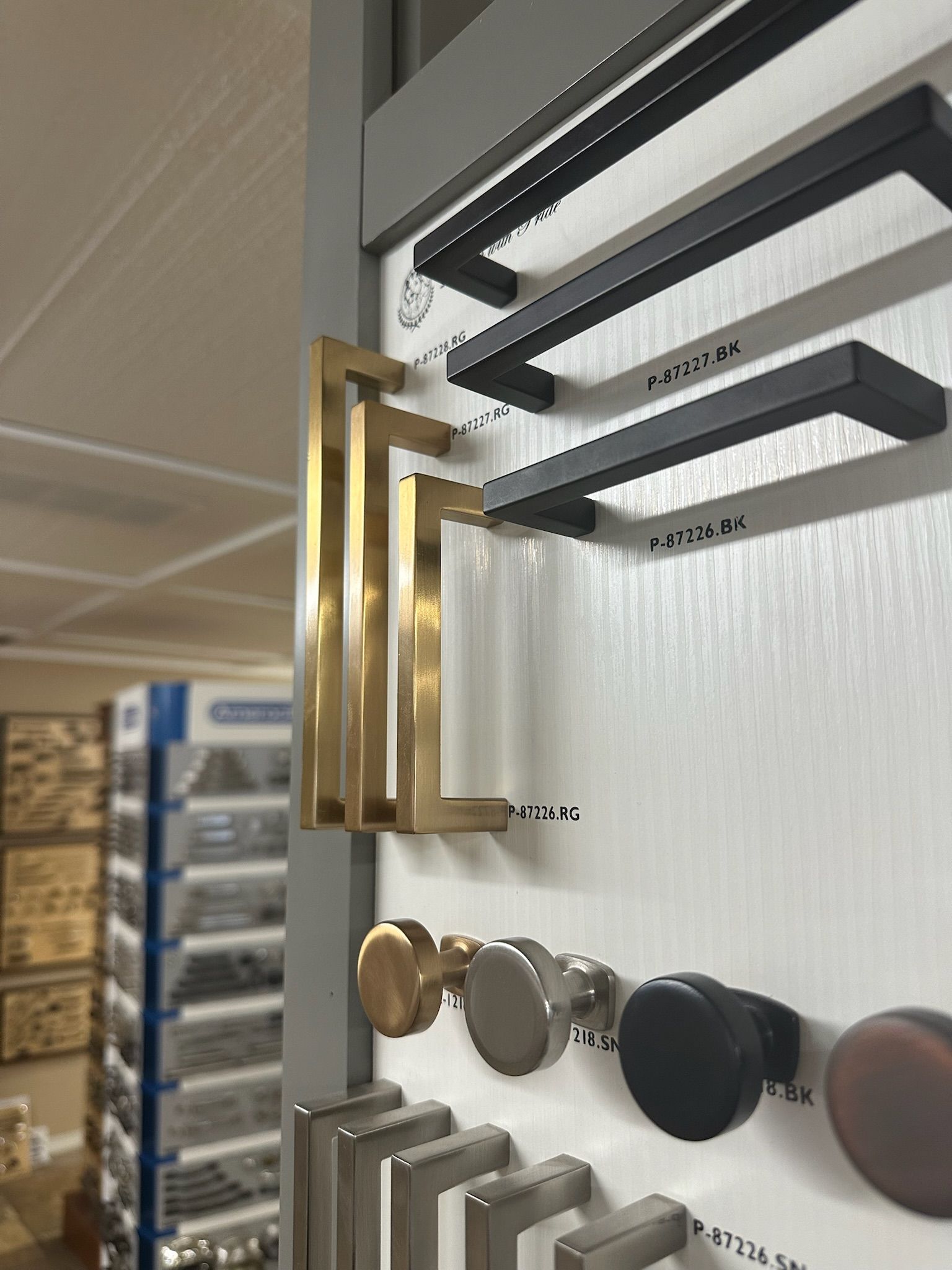 Display of cabinet hardware in various styles and colors.