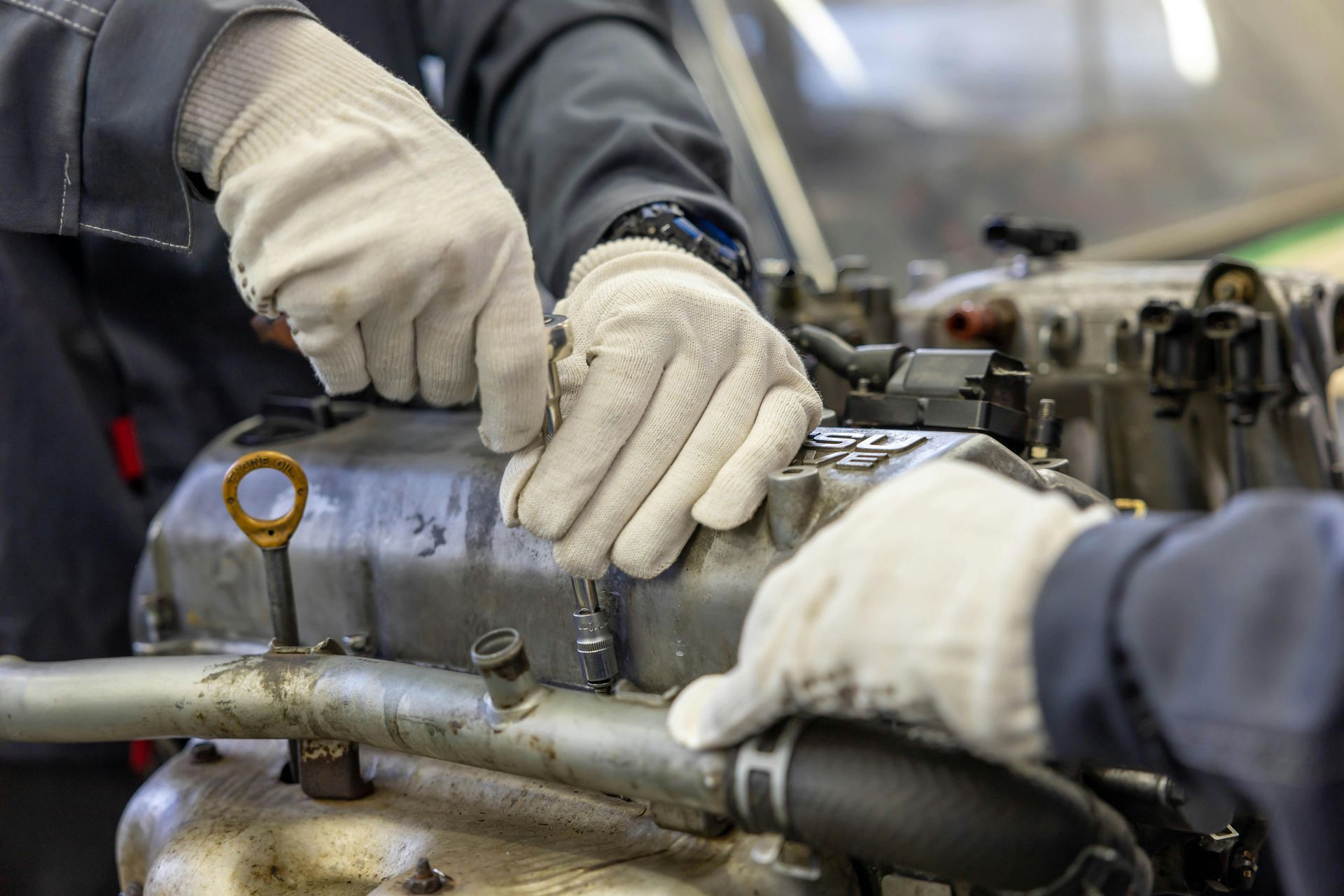 Auto Repair Technician Working On Engine Service | International Motors